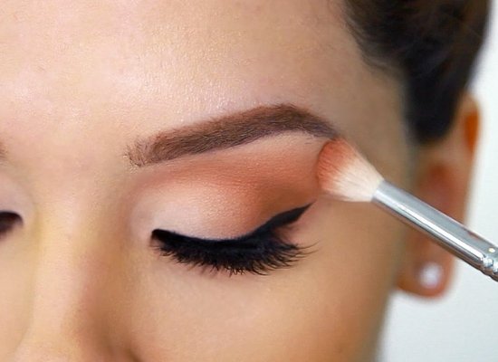 Applying eye shadow